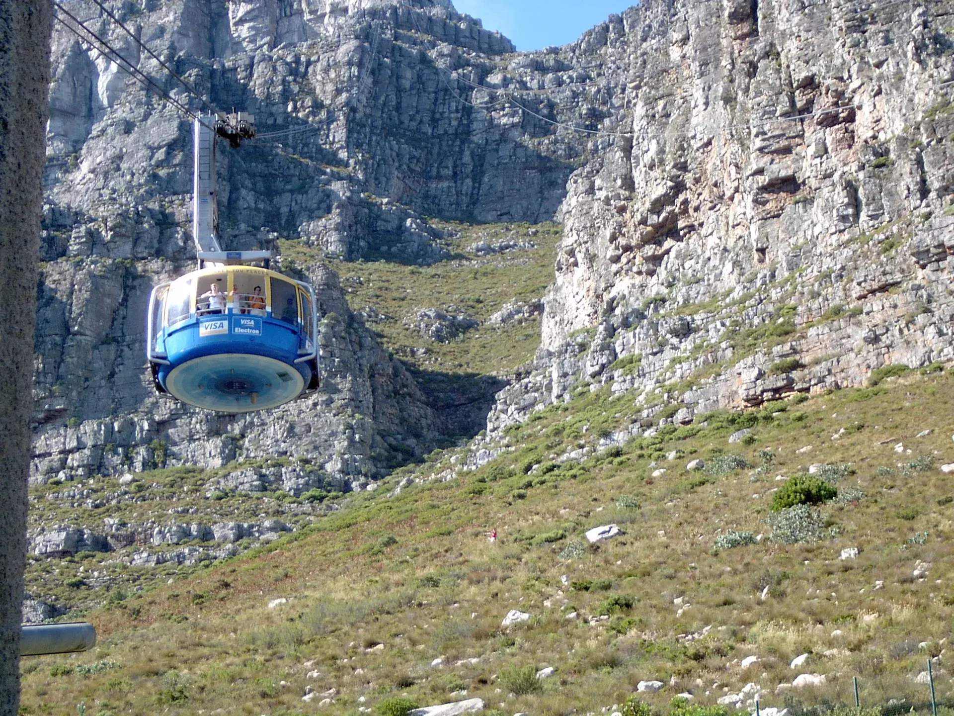 Cable car travelling beside the cliffs of Table Mountain